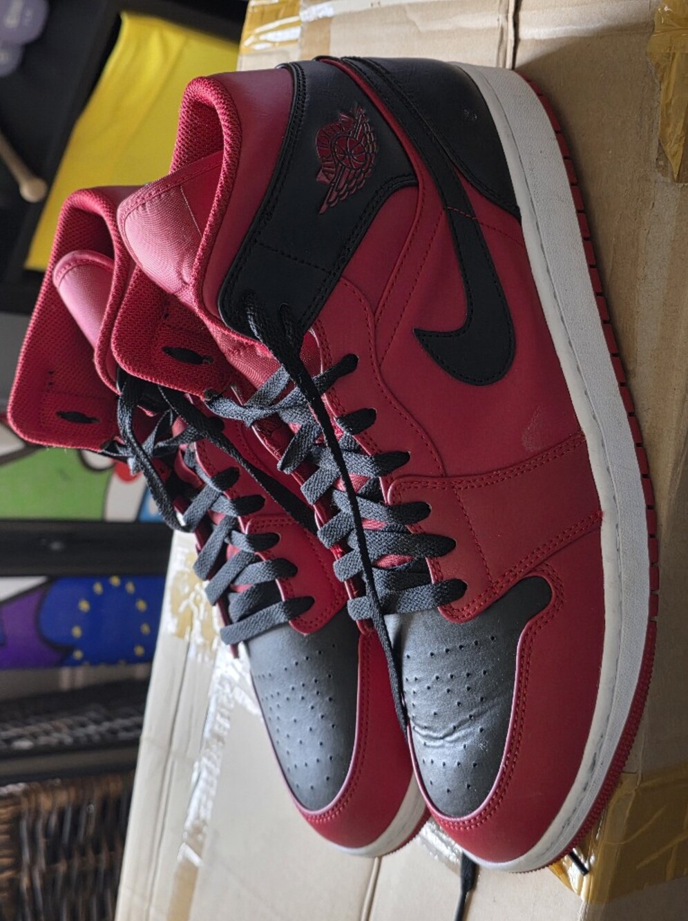 Jordan 1 Mid Red and Black High-Top Sneakers